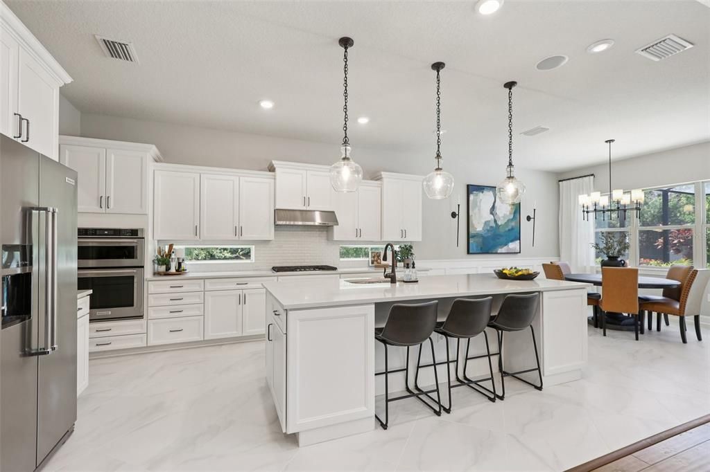 Chandelier, Dining room, Interior, Kitchen, Marble, Pendant Lights, Recessed Lighting, Stainless Steel Appliances