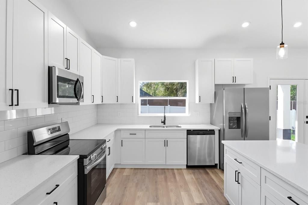 Interior, Kitchen, Pendant Lights, Recessed Lighting, Stainless Steel Appliances, Wood Texture Flooring
