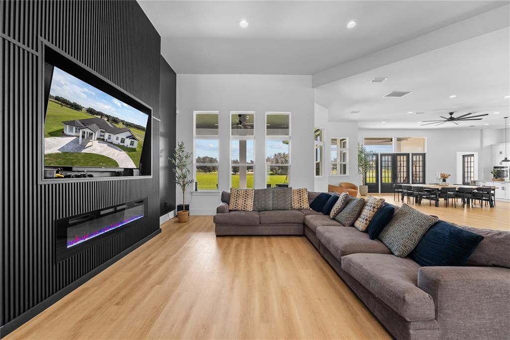 Dining room, Fireplace, Interior, Living room, Pendant Lights, Recessed Lighting, Wood Texture Flooring