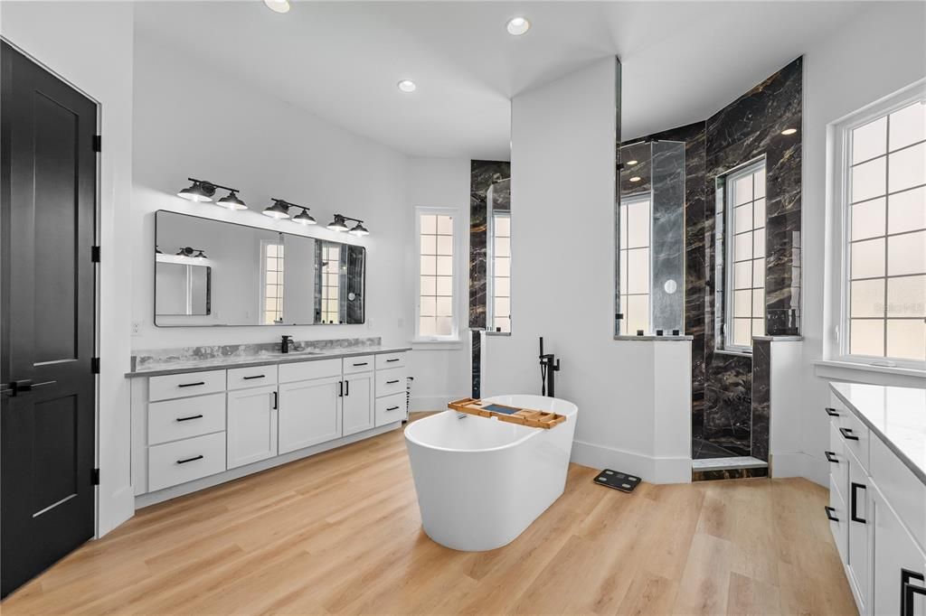 Bathroom, Dual Sink Vanities, Free Standing Baths, Interior, Marble Walls, Recessed Lighting, Wood Texture Flooring