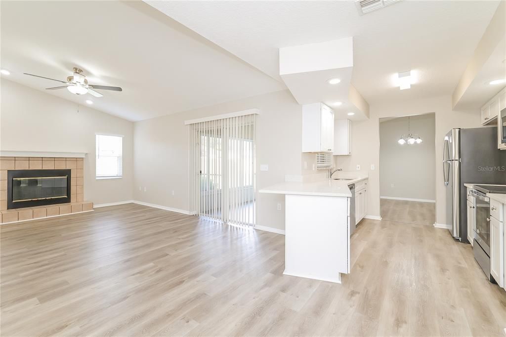Fireplace, Interior, Kitchen, Recessed Lighting, Wood Texture Flooring