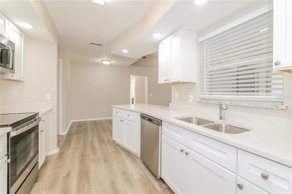 Interior, Kitchen, Recessed Lighting, Stainless Steel Appliances, Wood Texture Flooring