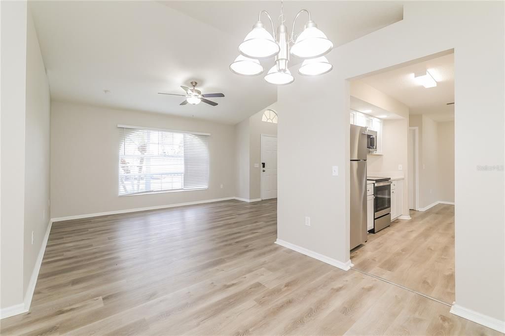 Empty room, Interior, Kitchen, Pendant Lights, Stainless Steel Appliances, Wood Texture Flooring