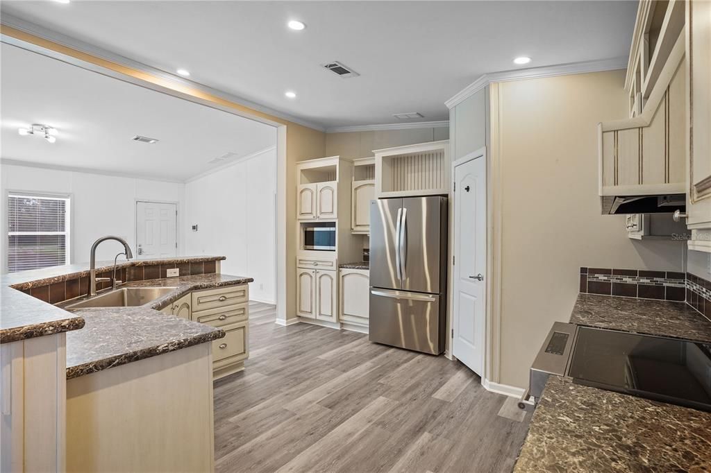 Interior, Kitchen, Recessed Lighting, Stainless Steel Appliances, Wood Texture Flooring