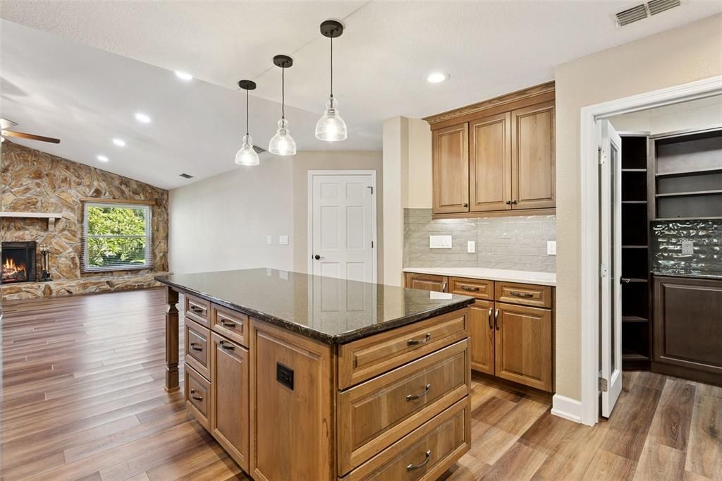 Fireplace, Interior, Kitchen, Pendant Lights, Recessed Lighting, Stone Walls, Wood Texture Flooring