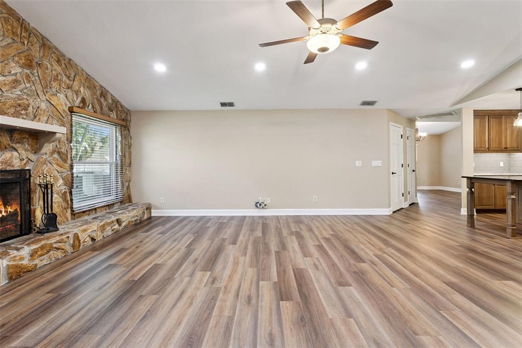 Empty room, Fireplace, Interior, Pendant Lights, Recessed Lighting, Stone Walls, Wood Texture Flooring