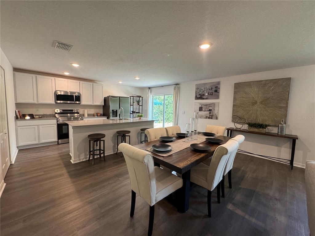 Dining room, Interior, Kitchen, Recessed Lighting, Stainless Steel Appliances, Wood Texture Flooring