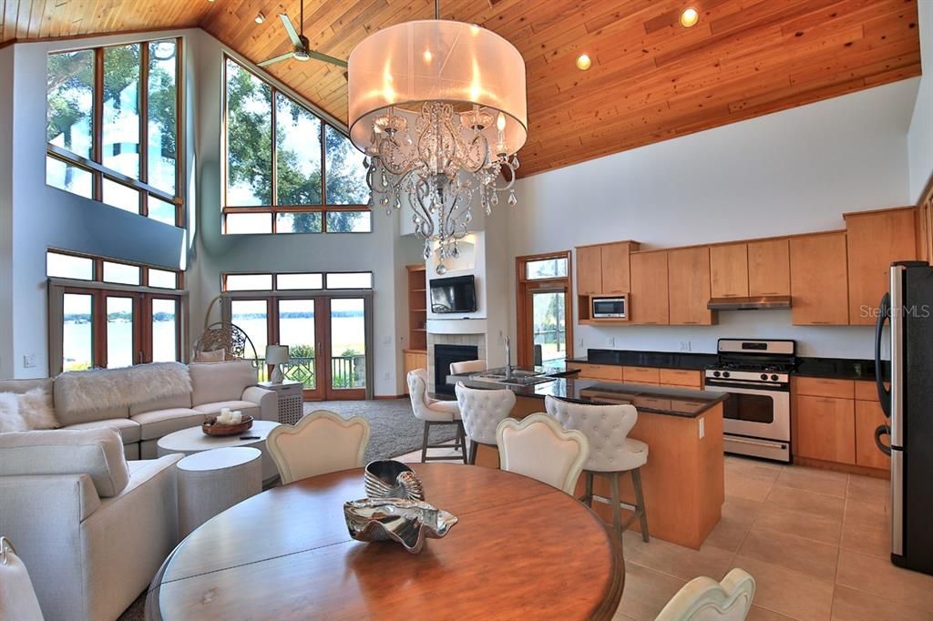 Chandelier, Dining room, Fireplace, Interior, Kitchen, Living room, Recessed Lighting, Stainless Steel Appliances, Wooden Beams, Wooden Ceilings