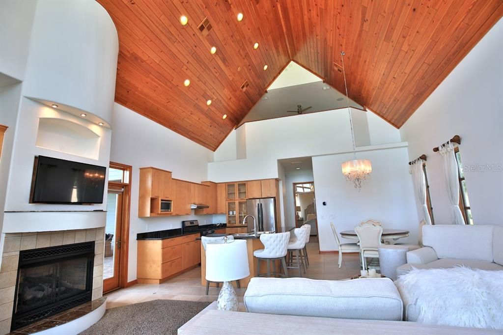 Chandelier, Dining room, Fireplace, Interior, Kitchen, Recessed Lighting, Stainless Steel Appliances, Wooden Ceilings