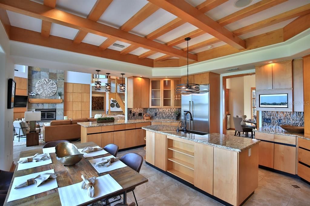 Dining room, Fireplace, Interior, Kitchen, Living room, Pendant Lights, Recessed Lighting, Stainless Steel Appliances, Stone Walls, Wooden Beams