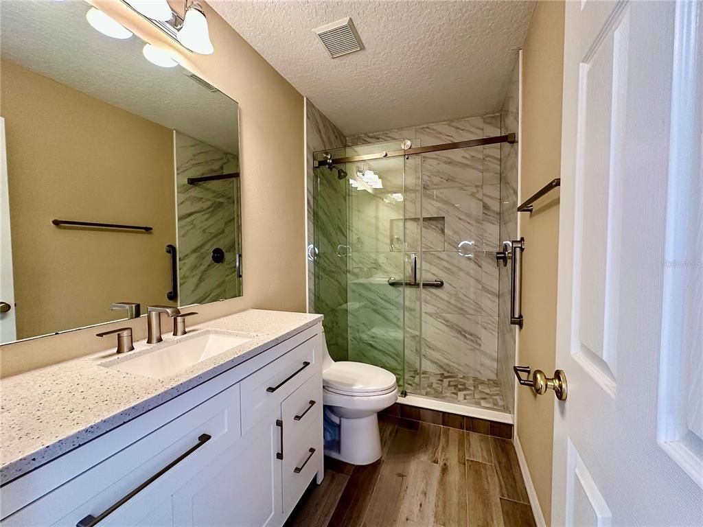 Bathroom, Glass Shower, Interior, Marble Walls, Wood Texture Flooring