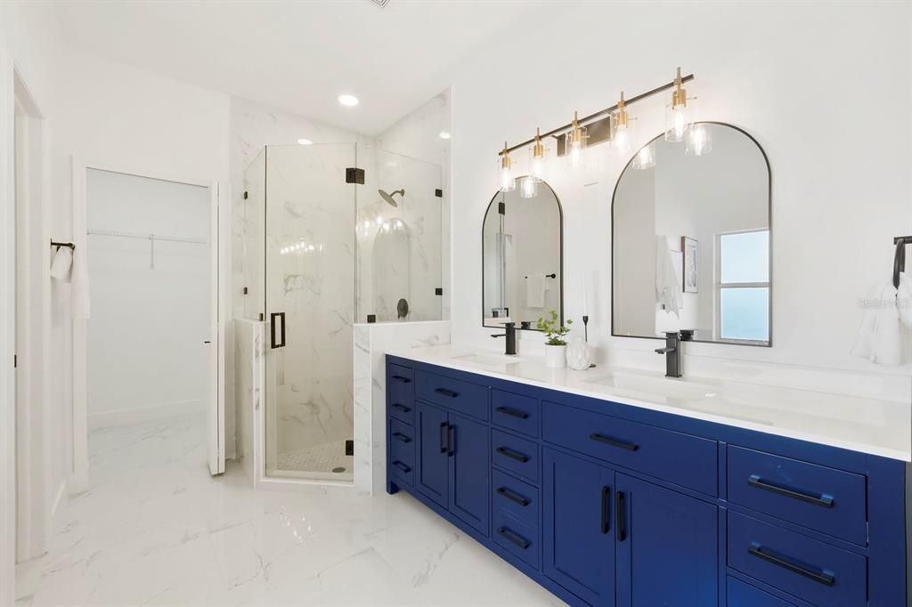 Bathroom, Dual Sink Vanities, Glass Shower, Interior, Marble, Marble Walls, Recessed Lighting