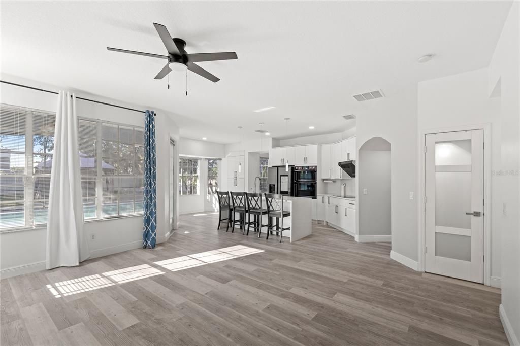 Dining room, Interior, Kitchen, Pendant Lights, Recessed Lighting, Stainless Steel Appliances, Wood Texture Flooring