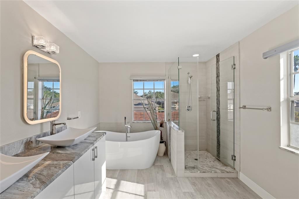 Bathroom, Free Standing Baths, Glass Shower, Interior, Recessed Lighting, Wood Texture Flooring