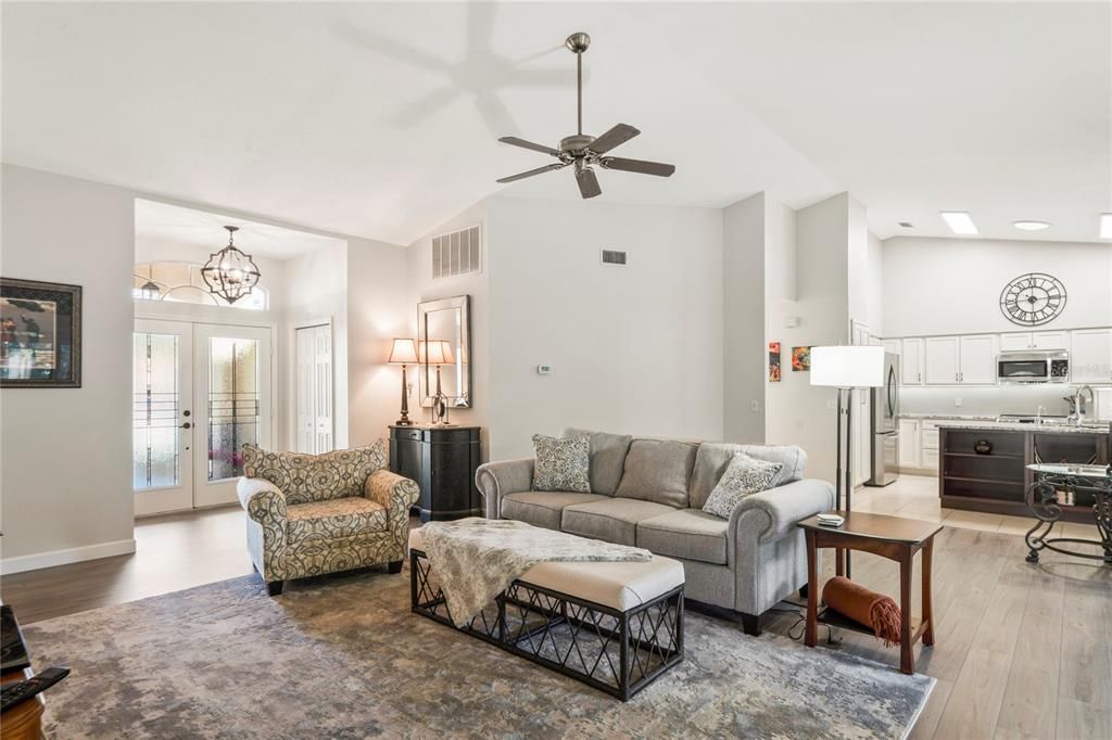 Chandelier, Interior, Kitchen, Living room, Recessed Lighting, Stainless Steel Appliances, Wood Texture Flooring