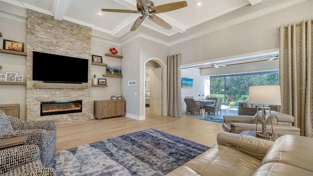 Fireplace, Interior, Living room, Recessed Lighting, Stone Walls, Wood Texture Flooring
