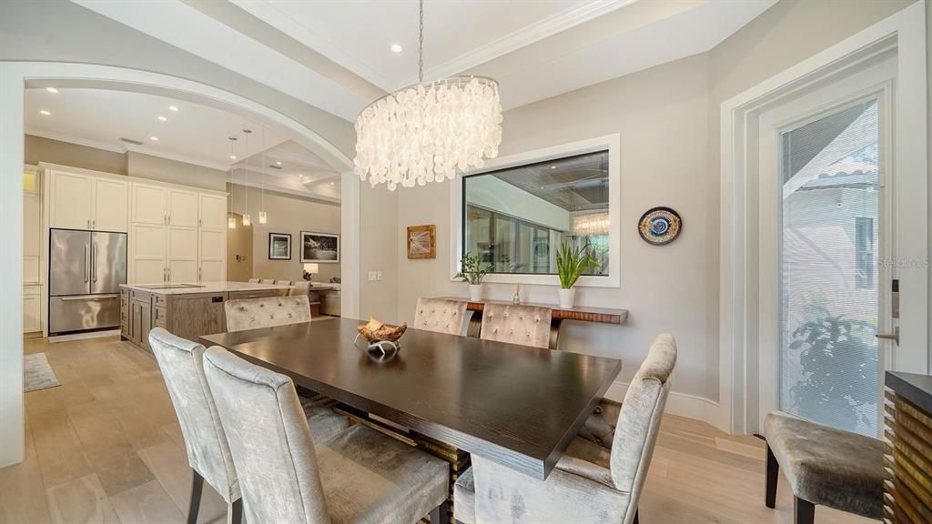Dining room, Fireplace, Interior, Living room, Recessed Lighting, Stone Walls, Wood Texture Flooring