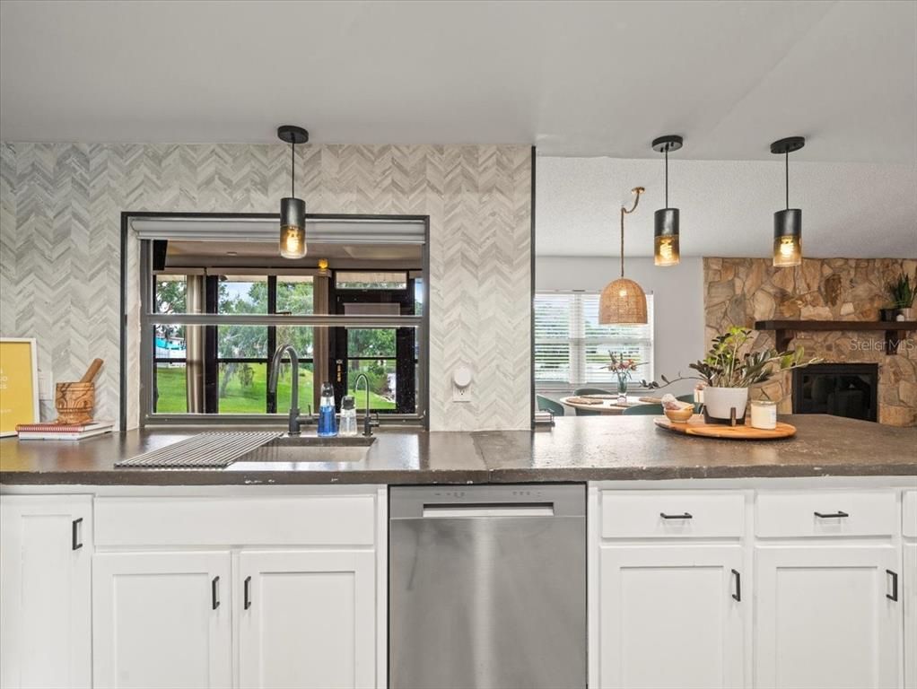Fireplace, Interior, Kitchen, Pendant Lights, Stainless Steel Appliances, Stone Walls