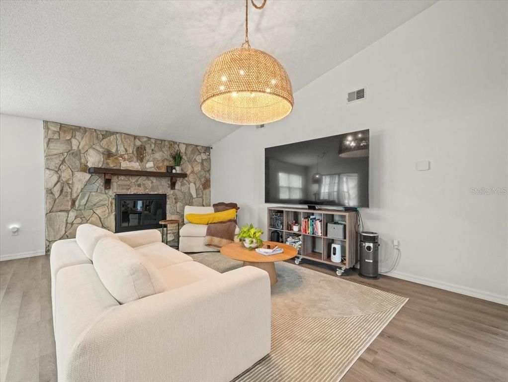 Fireplace, Interior, Living room, Pendant Lights, Stone Walls, Wood Texture Flooring