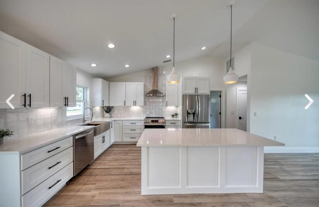 Interior, Kitchen, Pendant Lights, Recessed Lighting, Stainless Steel Appliances, Wood Texture Flooring