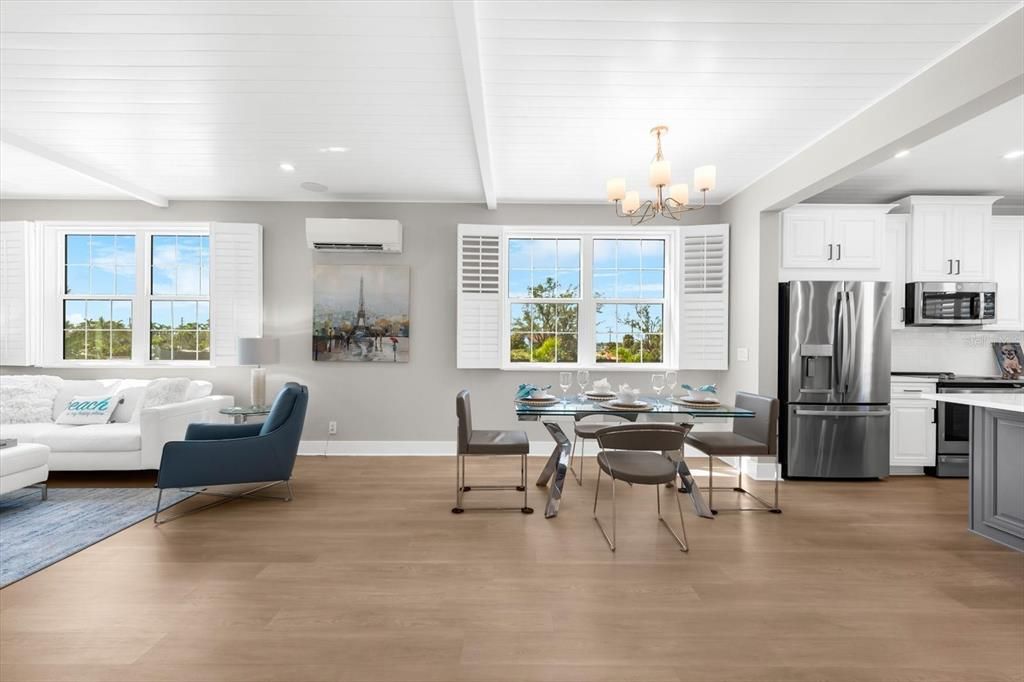 Chandelier, Dining room, Interior, Kitchen, Living room, Recessed Lighting, Stainless Steel Appliances, Water, Wood Texture Flooring