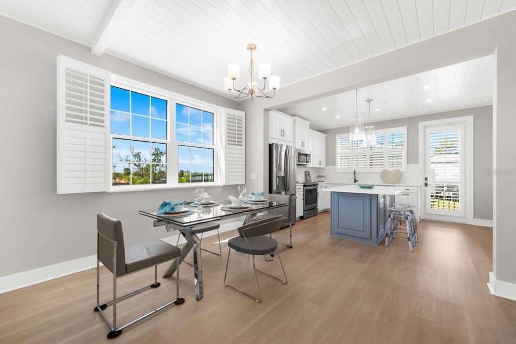 Chandelier, Dining room, Interior, Kitchen, Pendant Lights, Recessed Lighting, Stainless Steel Appliances, Wood Texture Flooring