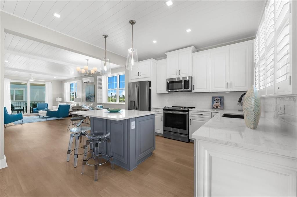 Chandelier, Interior, Kitchen, Living room, Pendant Lights, Recessed Lighting, Stainless Steel Appliances, Wood Texture Flooring