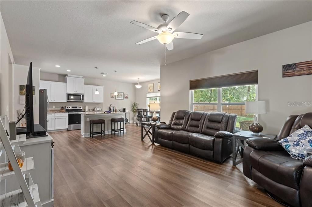 Dining room, Interior, Kitchen, Living room, Pendant Lights, Recessed Lighting, Stainless Steel Appliances, Wood Texture Flooring