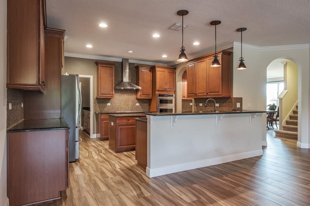 Interior, Kitchen, Pendant Lights, Recessed Lighting, Stainless Steel Appliances, Wood Texture Flooring
