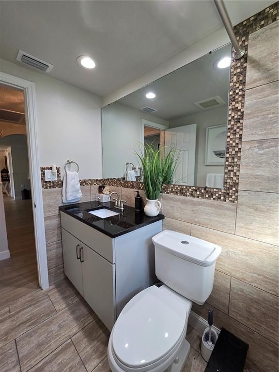 Bathroom, Dual Sink Vanities, Interior, Recessed Lighting, Wood Texture Flooring