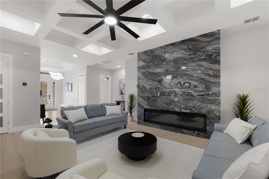 Fireplace, Interior, Living room, Marble Walls, Pendant Lights, Recessed Lighting, Wood Texture Flooring