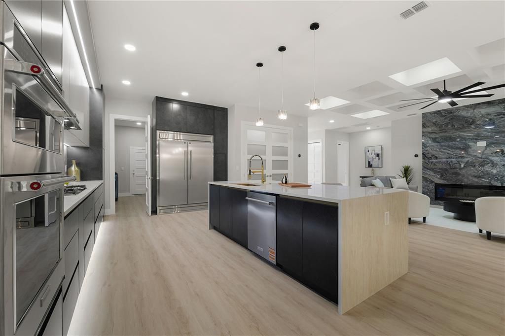 Fireplace, Interior, Kitchen, Living room, Pendant Lights, Recessed Lighting, Stainless Steel Appliances, Wood Texture Flooring