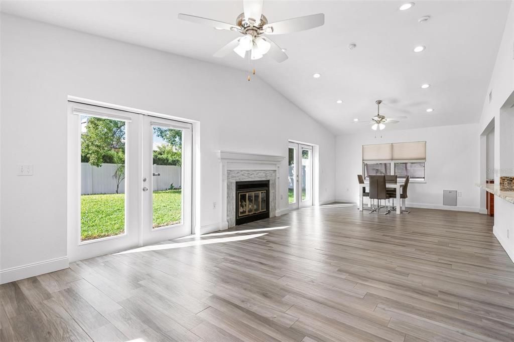 Dining room, Empty room, Fireplace, Interior, Recessed Lighting, Wood Texture Flooring