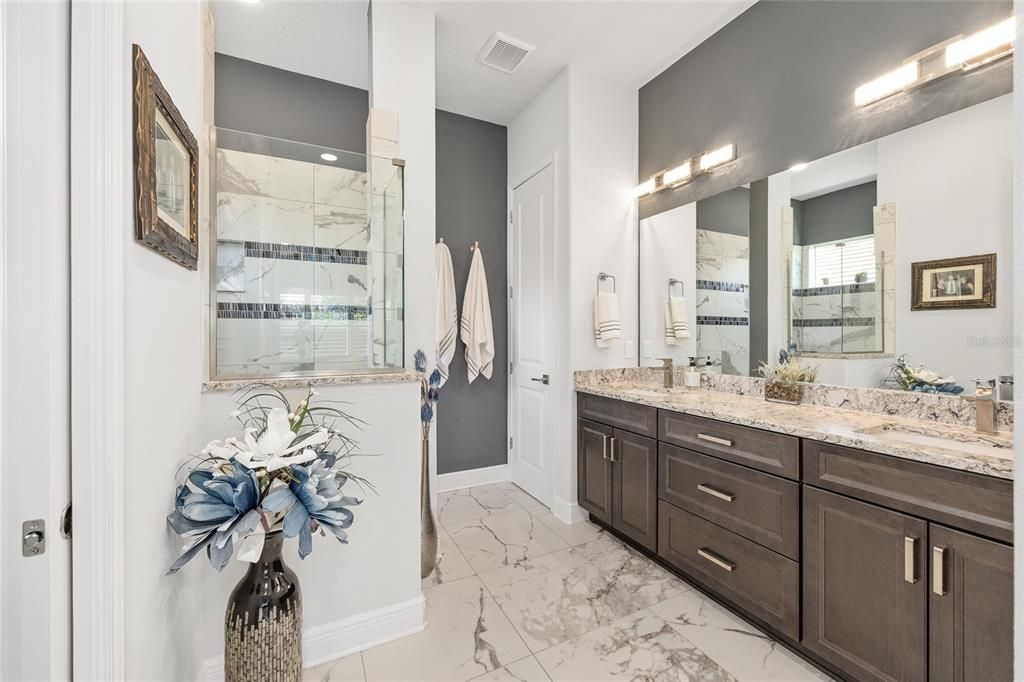 Bathroom, Dual Sink Vanities, Glass Shower, Interior, Marble, Marble Walls, Recessed Lighting