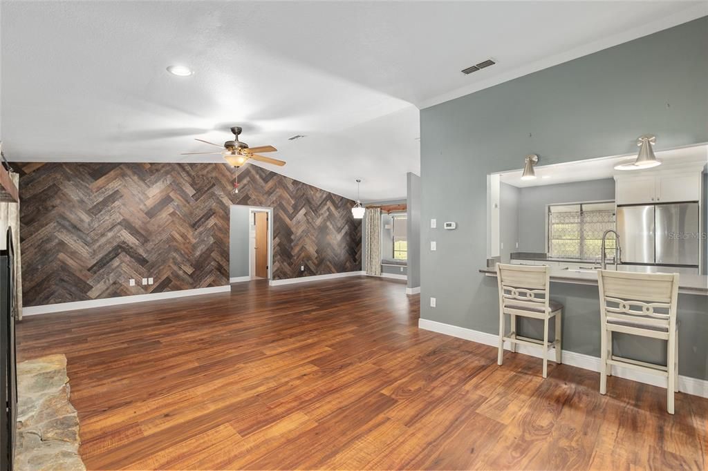 Empty room, Interior, Kitchen, Pendant Lights, Recessed Lighting, Stainless Steel Appliances, Wood Texture Flooring
