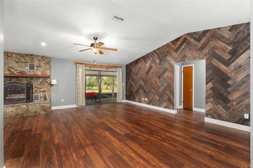 Empty room, Fireplace, Interior, Recessed Lighting, Stone Walls, Wood Texture Flooring, Wooden Walls