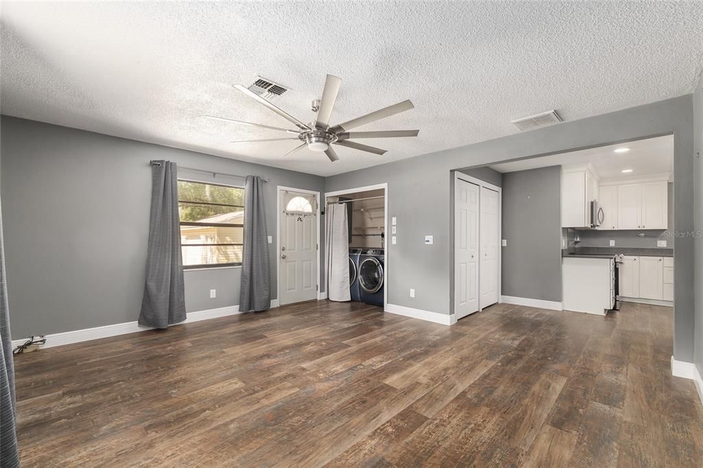 Empty room, Interior, Kitchen, Recessed Lighting, Washer, Wood Texture Flooring