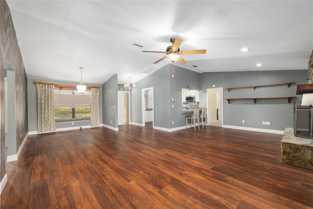 Chandelier, Empty room, Fireplace, Interior, Pendant Lights, Recessed Lighting, Wood Texture Flooring