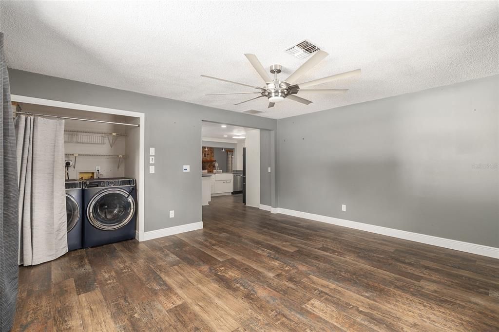 Empty room, Interior, Recessed Lighting, Utility Closets, Washer, Wood Texture Flooring
