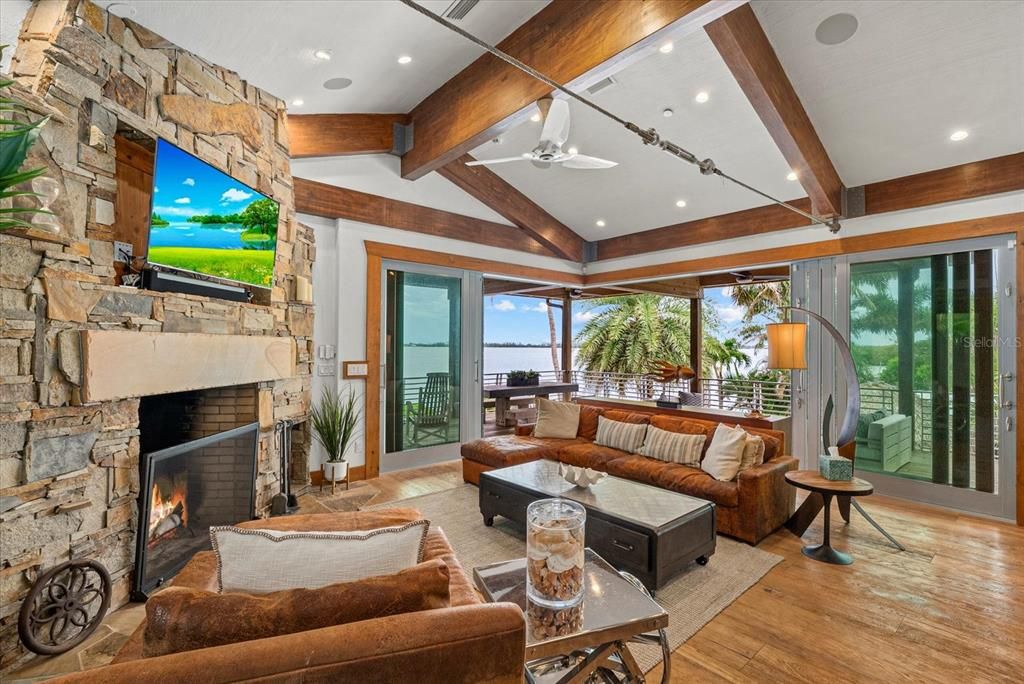 Fireplace, Interior, Living room, Recessed Lighting, Stone Walls, Water, Wooden Beams, Wood Texture Flooring
