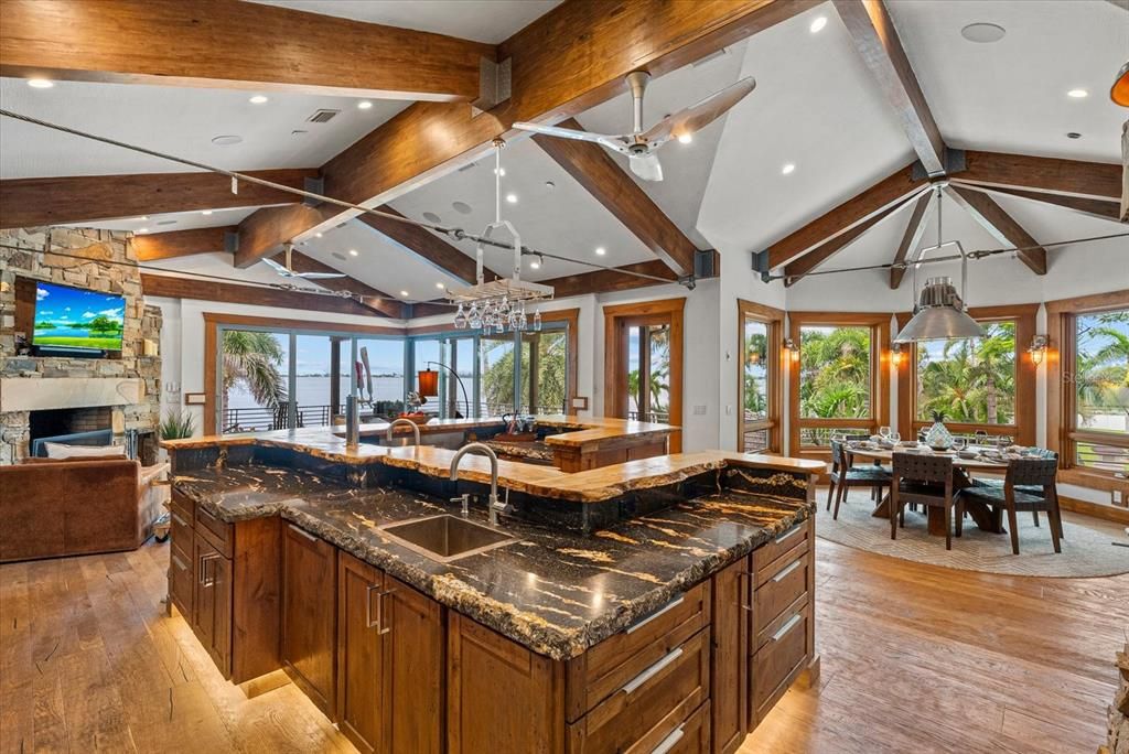 Chandelier, Dining room, Fireplace, Interior, Living room, Pendant Lights, Recessed Lighting, Wooden Beams, Wood Texture Flooring