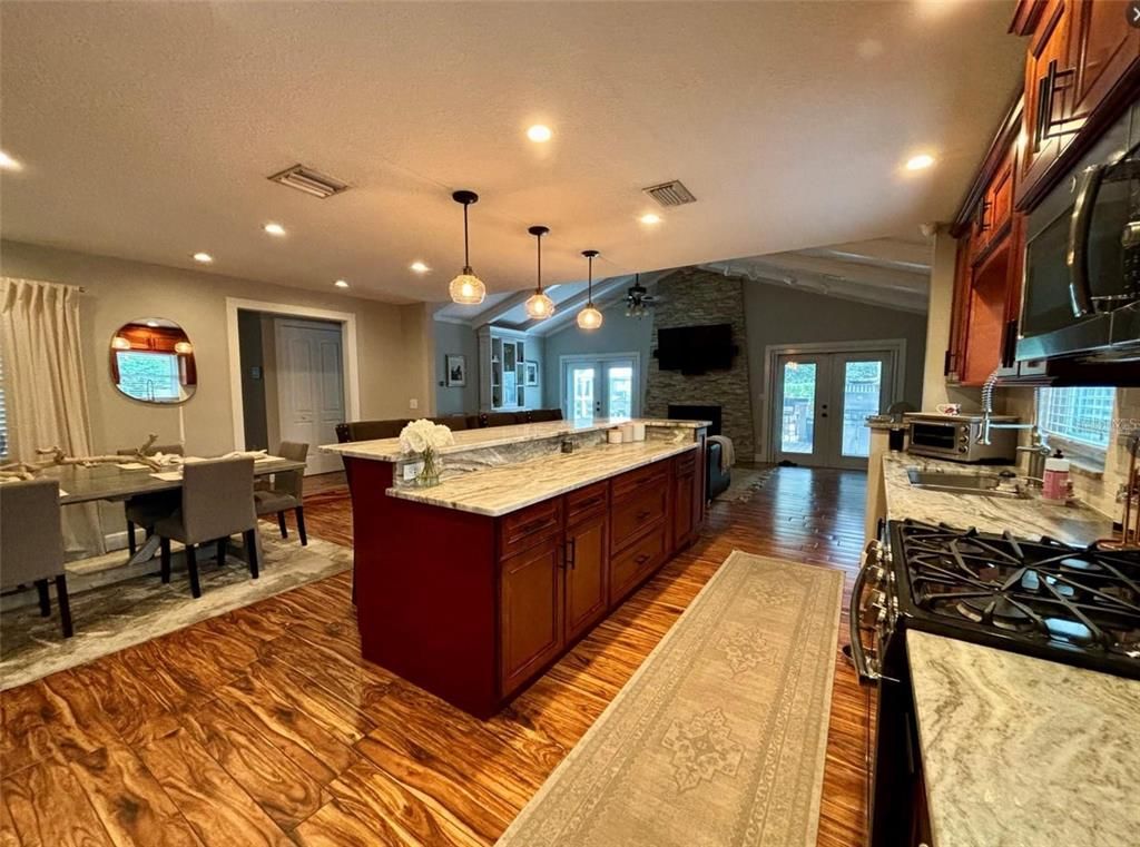 Dining room, Fireplace, Interior, Kitchen, Pendant Lights, Recessed Lighting, Stone Walls, Wood Texture Flooring