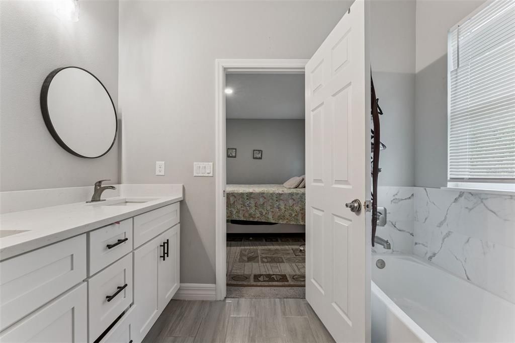 Bathroom, Bedroom, Dual Sink Vanities, Interior, Marble Walls, Recessed Lighting, Wood Texture Flooring
