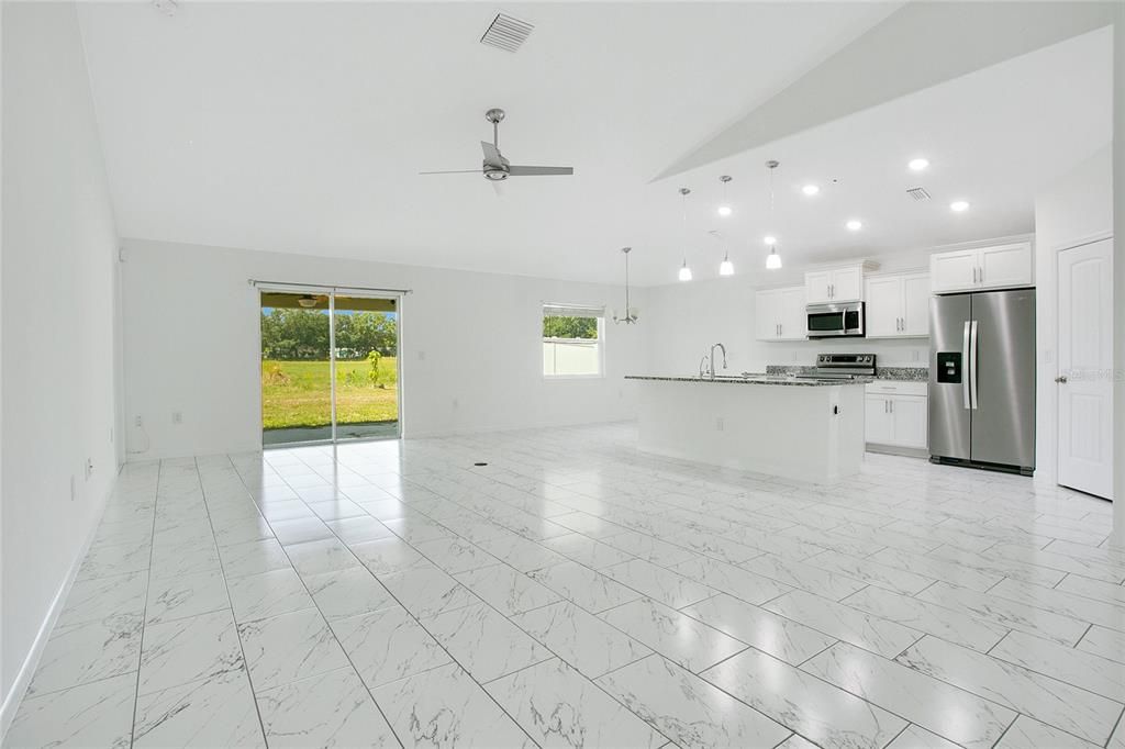 Empty room, Interior, Kitchen, Marble, Pendant Lights, Recessed Lighting, Stainless Steel Appliances