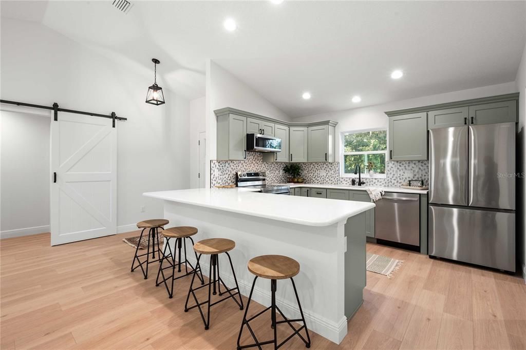 Interior, Kitchen, Pendant Lights, Recessed Lighting, Stainless Steel Appliances, Wood Texture Flooring