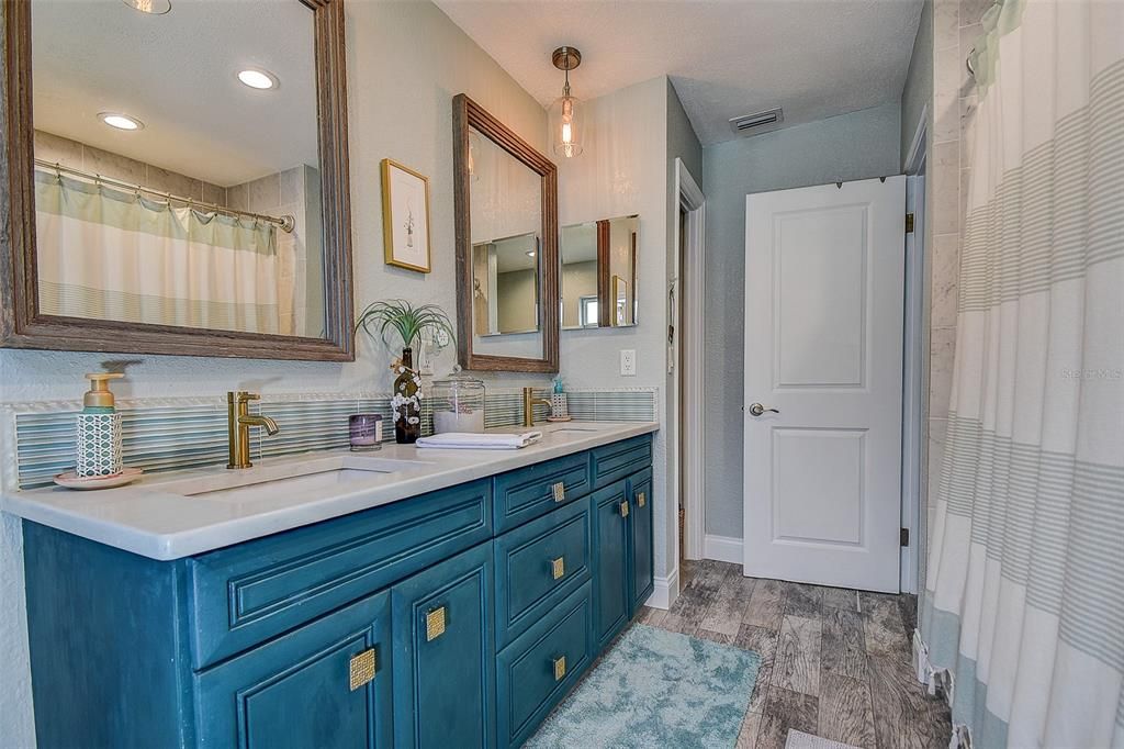 Bathroom, Dual Sink Vanities, Interior, Pendant Lights, Recessed Lighting, Wood Texture Flooring