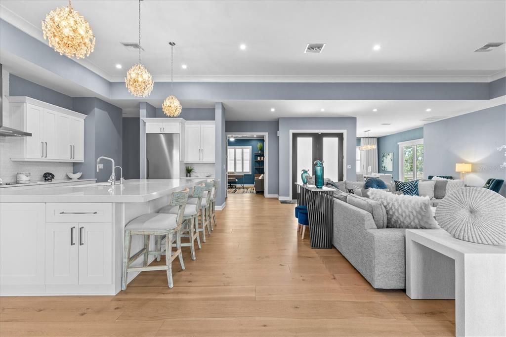 Chandelier, Interior, Kitchen, Living room, Pendant Lights, Recessed Lighting, Stainless Steel Appliances, Wood Texture Flooring