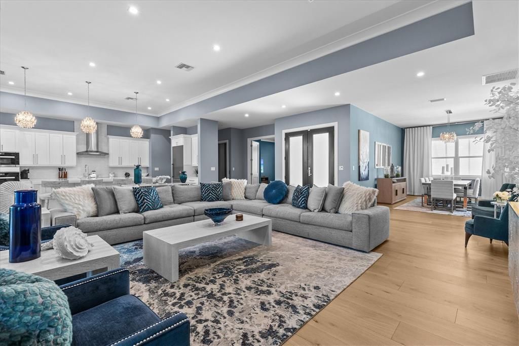 Chandelier, Dining room, Interior, Kitchen, Living room, Pendant Lights, Recessed Lighting, Stainless Steel Appliances, Wood Texture Flooring