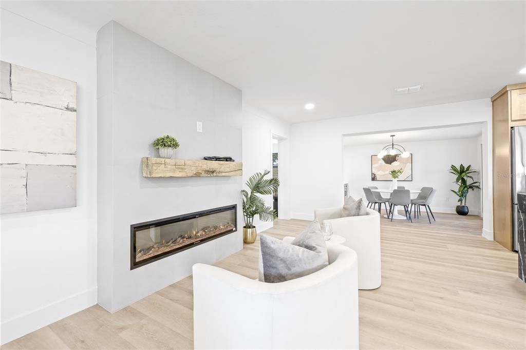 Dining room, Fireplace, Interior, Living room, Pendant Lights, Recessed Lighting, Wood Texture Flooring