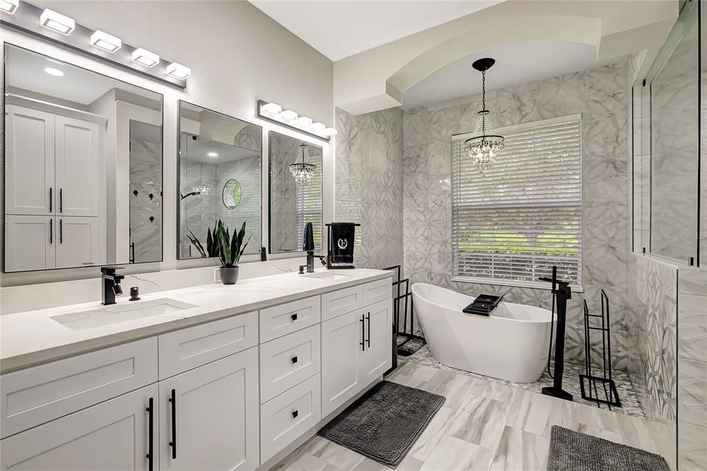Bathroom, Chandelier, Dual Sink Vanities, Free Standing Baths, Glass Shower, Interior, Marble, Marble Walls, Pendant Lights